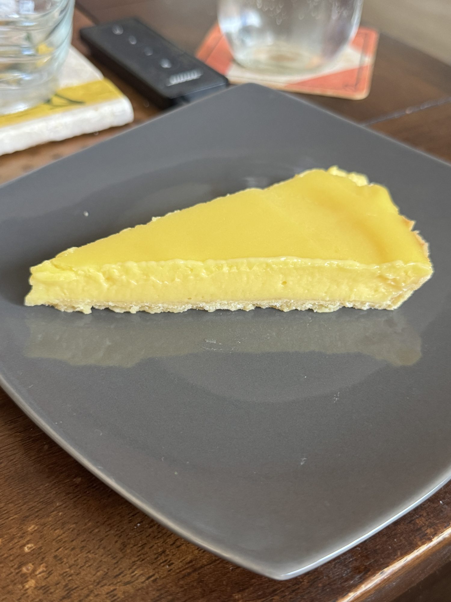 Classic French lemon tart with golden crust and glossy lemon curd filling
