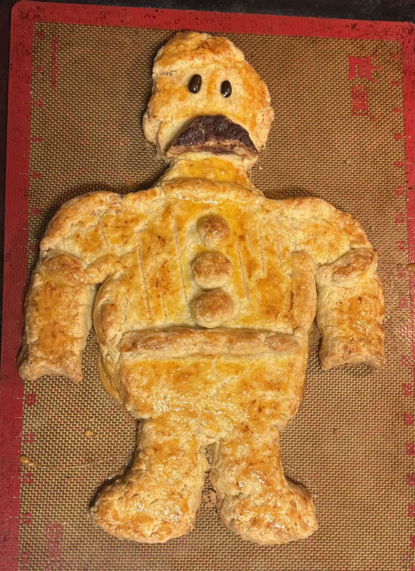 Buttery Suisse de Valence biscuit shaped like man.