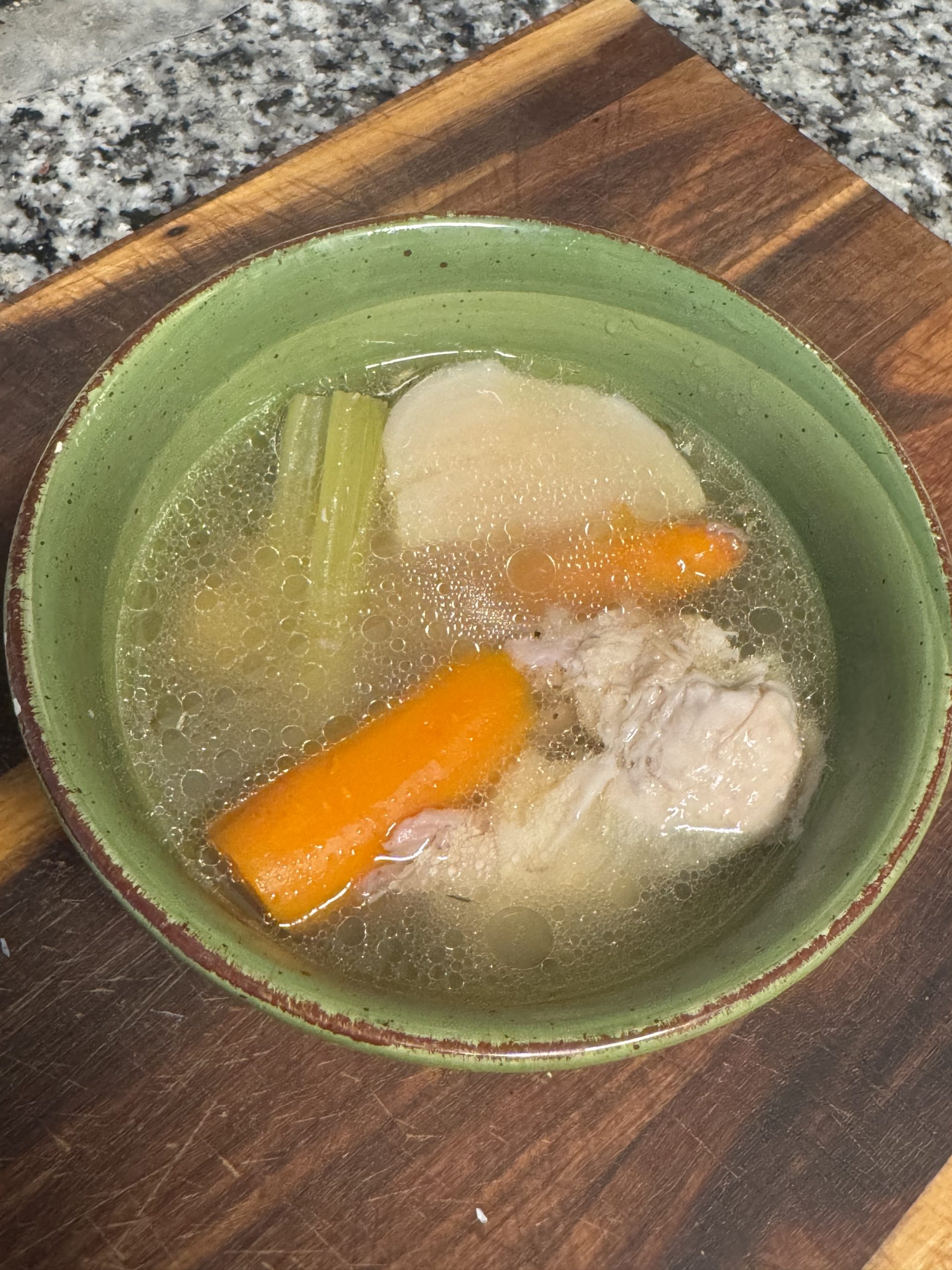 poule au pot in green bowl